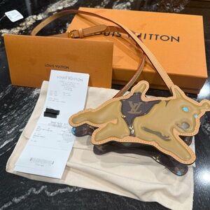 NEW! Louis Vuitton Craggy Dog on Strap. Comes with original receipt.